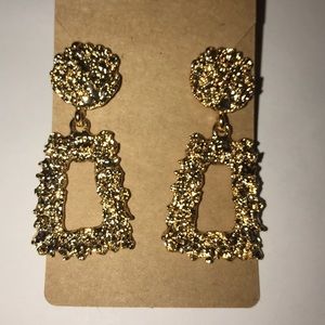 Gold colored diamond cut textured earrings